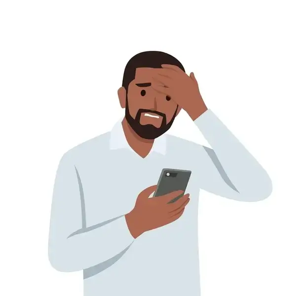 Un homme regarde son téléphone avec un air dépassé par la technologie.